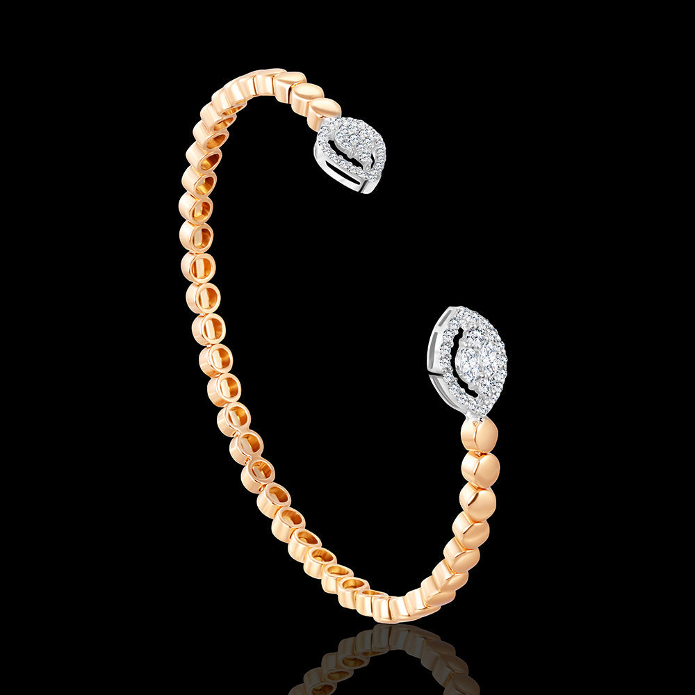 The airy rosegold bangle elegantly edged with round-pear shape stones - I-X30B